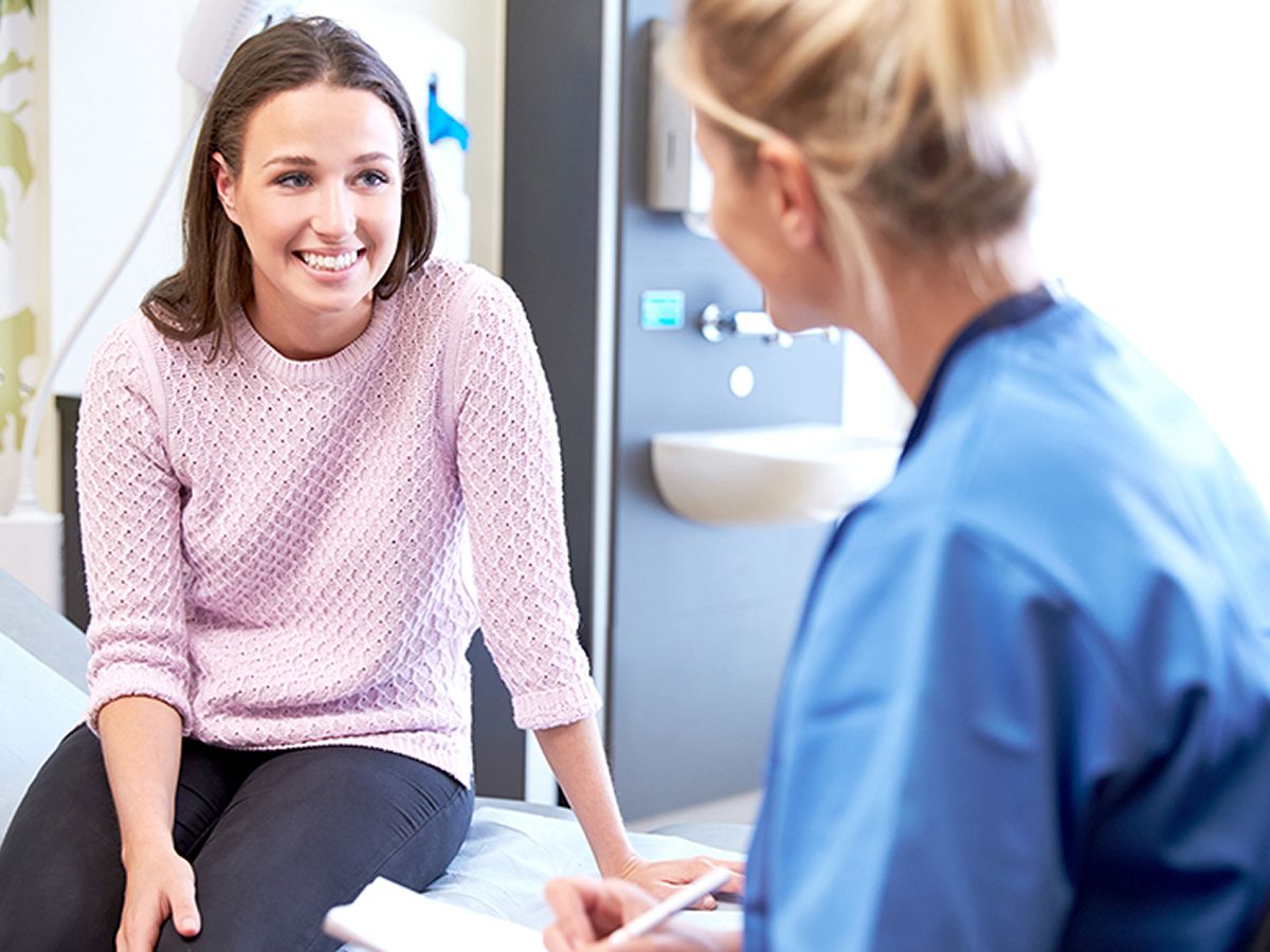Eatontown medical spa patient smiling during a medical consultation.
