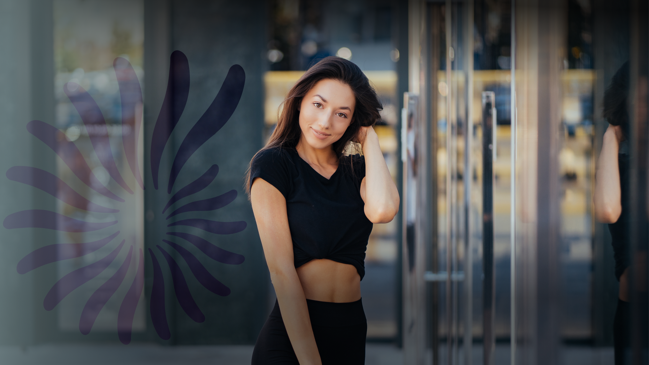 Eatontown med spa model posing outdoors in casual black outfit.